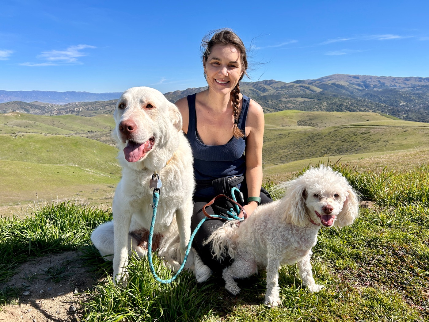 Georgia on a hillside with Luna and Ginger