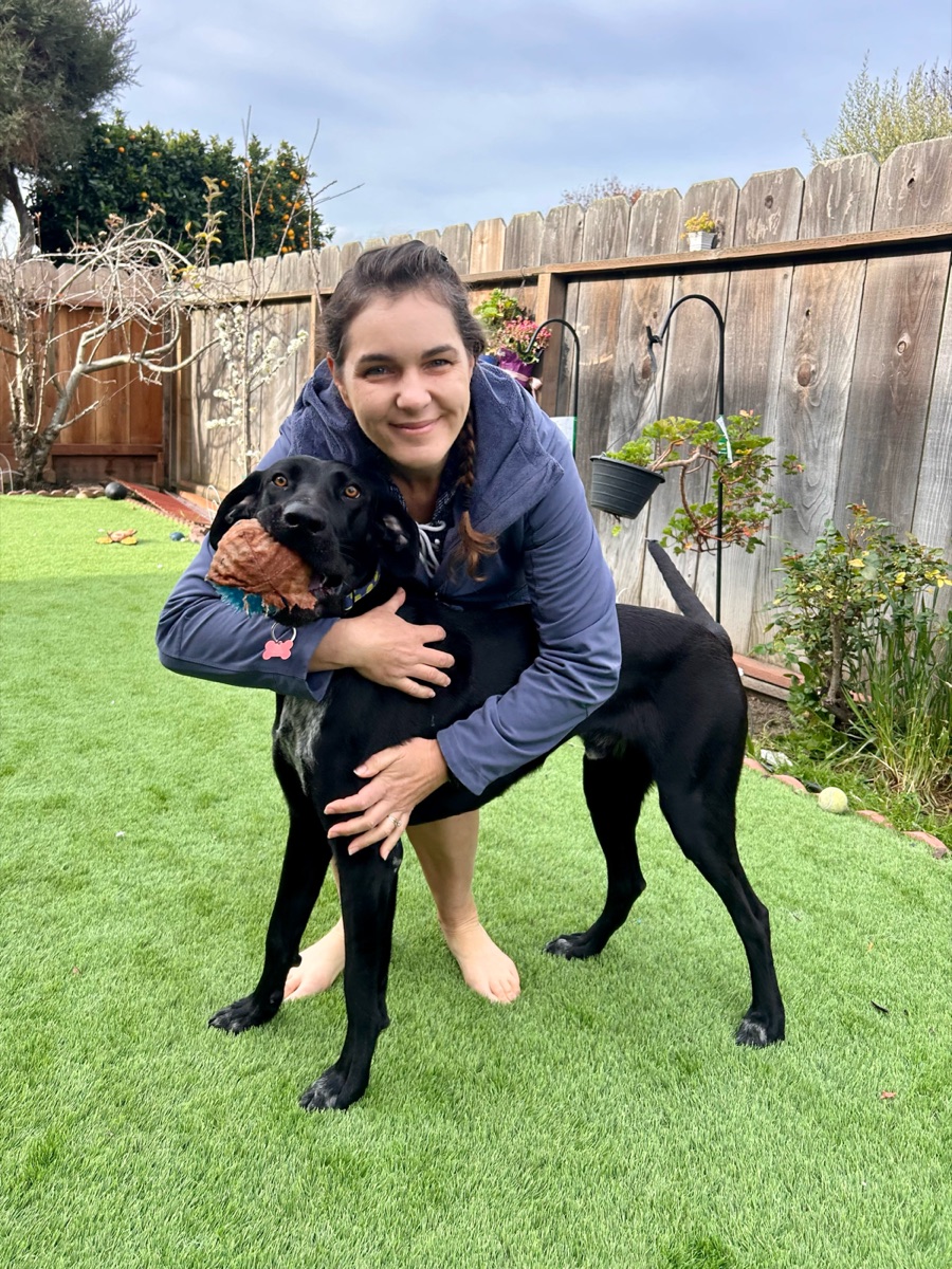 Georgia hugging Henri on the lawn